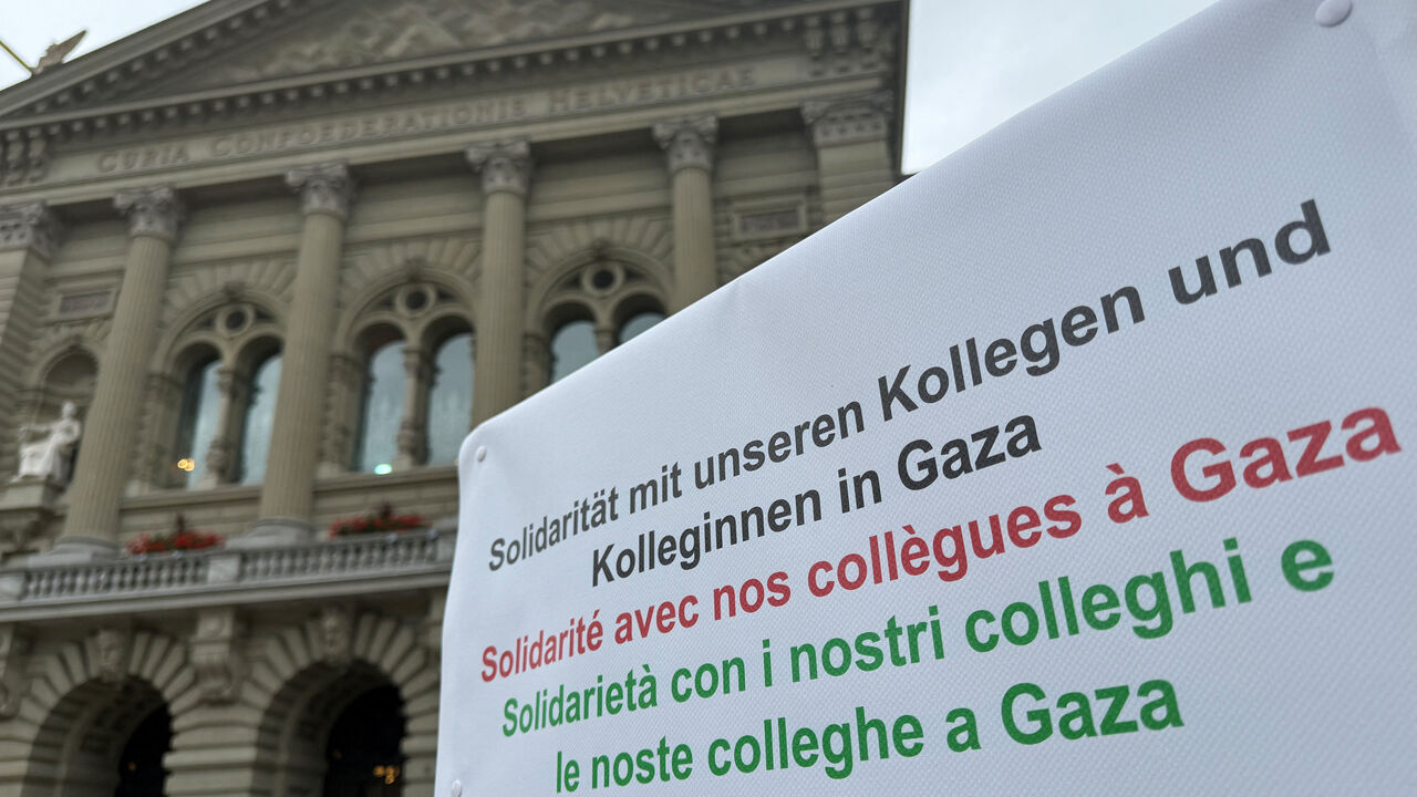 A sign of solidarity with their colleagues in Gaza, from Swiss doctors Michele Ghielmini, Brenno Balestra, Alessandra Guaita and Marco Franzi, is seen outside the Swiss Parliament building (Bundeshaus) at the start of their hunger strike over Gaza, calling on their government to apply targeted sanctions on Israel over its alleged violations of international law and to recognise a Palestinian state, in Bern, Switzerland, September 8, 2025.  REUTERS/Cecile Mantovani