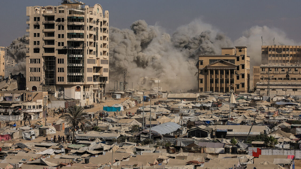FILE PHOTO: Smoke rises as a residential building collapses after an Israeli air strike, in Gaza City, September 8, 2025. REUTERS/Dawoud Abu Alkas/File Photo