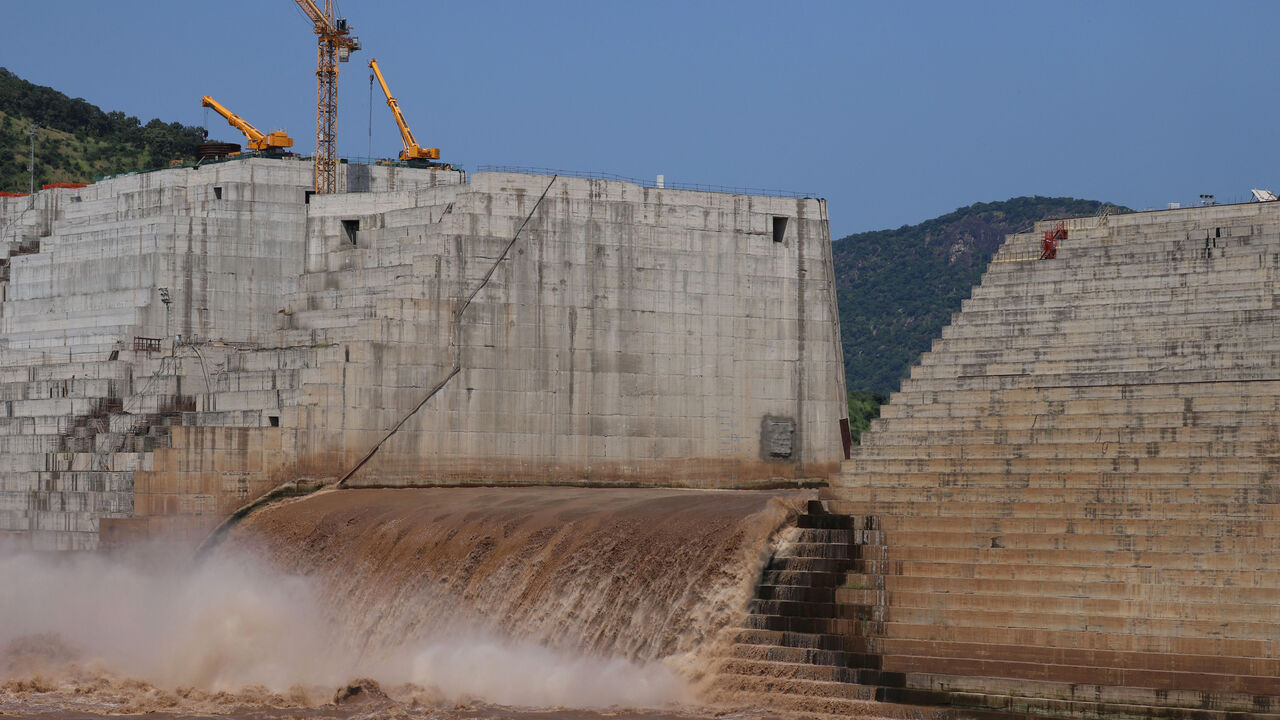 FILE PHOTO: Water flows through Ethiopia's Grand Renaissance Dam as it undergoes construction work on the river Nile in Guba Woreda, Benishangul Gumuz Region, Ethiopia September 26, 2019. Picture taken September 26, 2019. REUTERS/Tiksa Negeri/File Photo