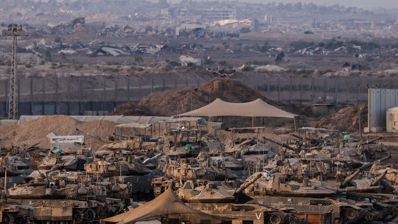 FILE PHOTO: Israeli tanks stand on the Israeli side of the border with Gaza, in Israel September 6, 2025. REUTERS/Amir Cohen/File photo