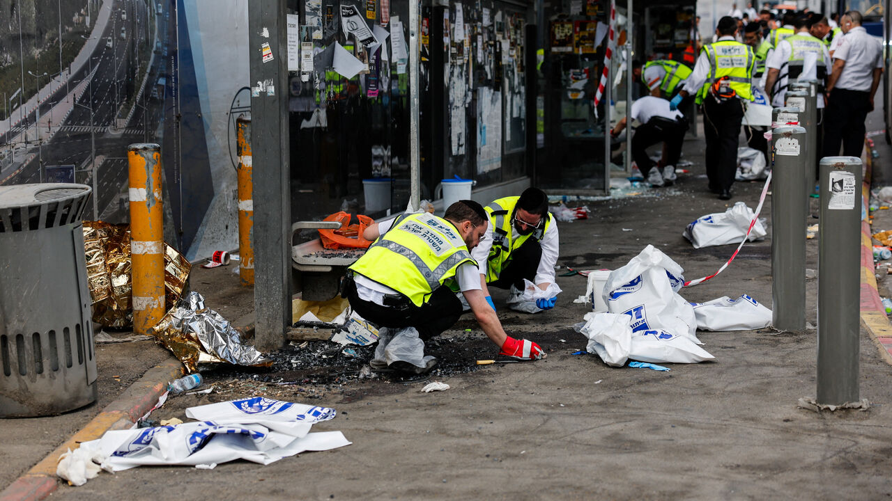 Emergency personnel work at the scene where a suspected shooting attack took place at the outskirts of Jerusalem, September 8, 2025 REUTERS/Ammar Awad