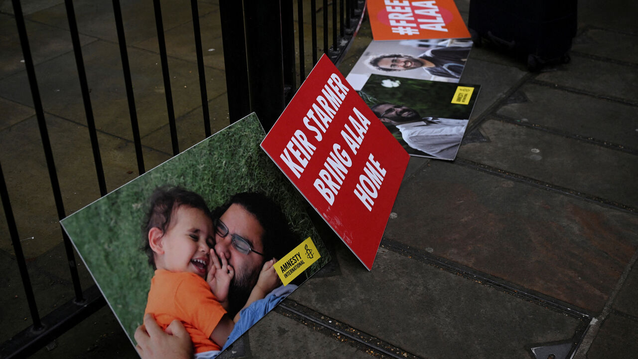 FILE PHOTO: Signage to support Egyptian-British activist Alaa Abd el-Fattah is displayed during the hunger strike of Laila Soueif to protest against her son's detention in Egypt, outside Downing Street in Westminster in London, Britain, February 10, 2025.  REUTERS/Jaimi Joy/File Photo