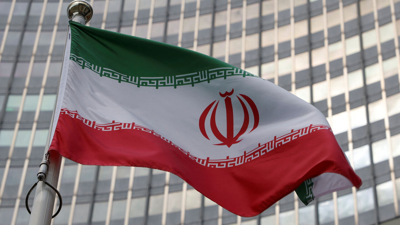 FILE PHOTO: The Iranian flag flutters in front of the International Atomic Energy Agency (IAEA) organisation's headquarters in Vienna, Austria, June 5, 2023. REUTERS/Leonhard Foeger/ File Photo