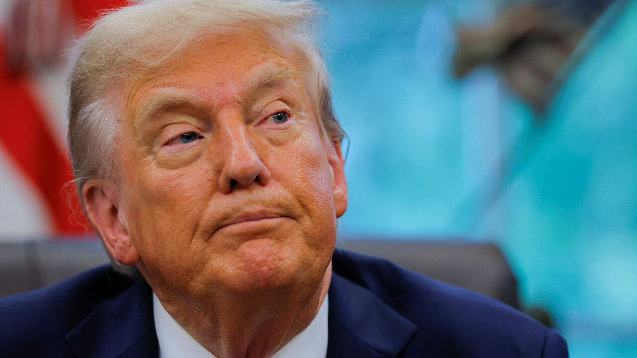 FILE PHOTO: U.S. President Donald Trump looks on as he speaks with the media in the Oval Office, at the White House in Washington, D.C., U.S., September 5, 2025. REUTERS/Brian Snyder/ File Photo