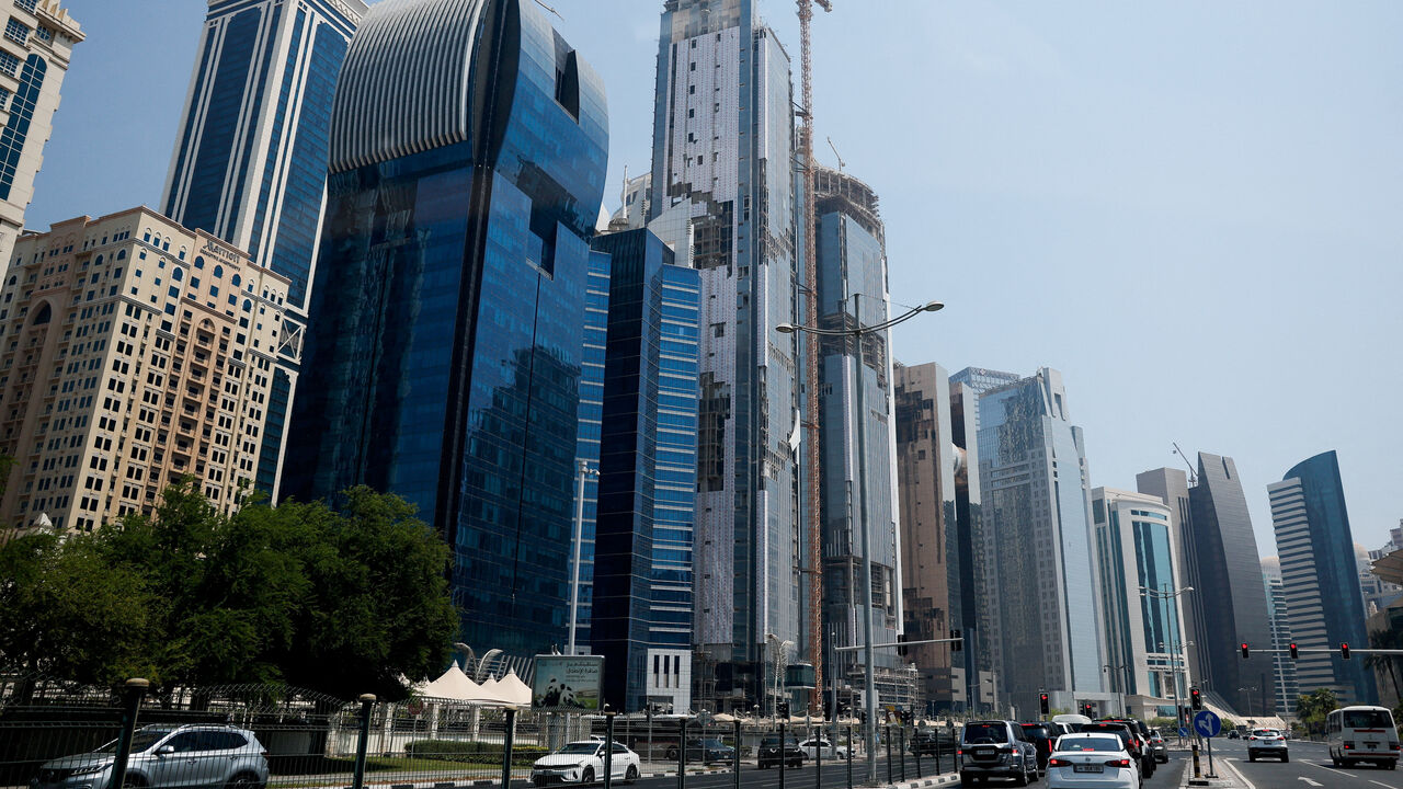 FILE PHOTO: Vehicles stop at a red traffic light, a day after an Israeli attack on Hamas leaders, in Doha, Qatar, September 10, 2025. REUTERS/Ibraheem Abu Mustafa/File Photo