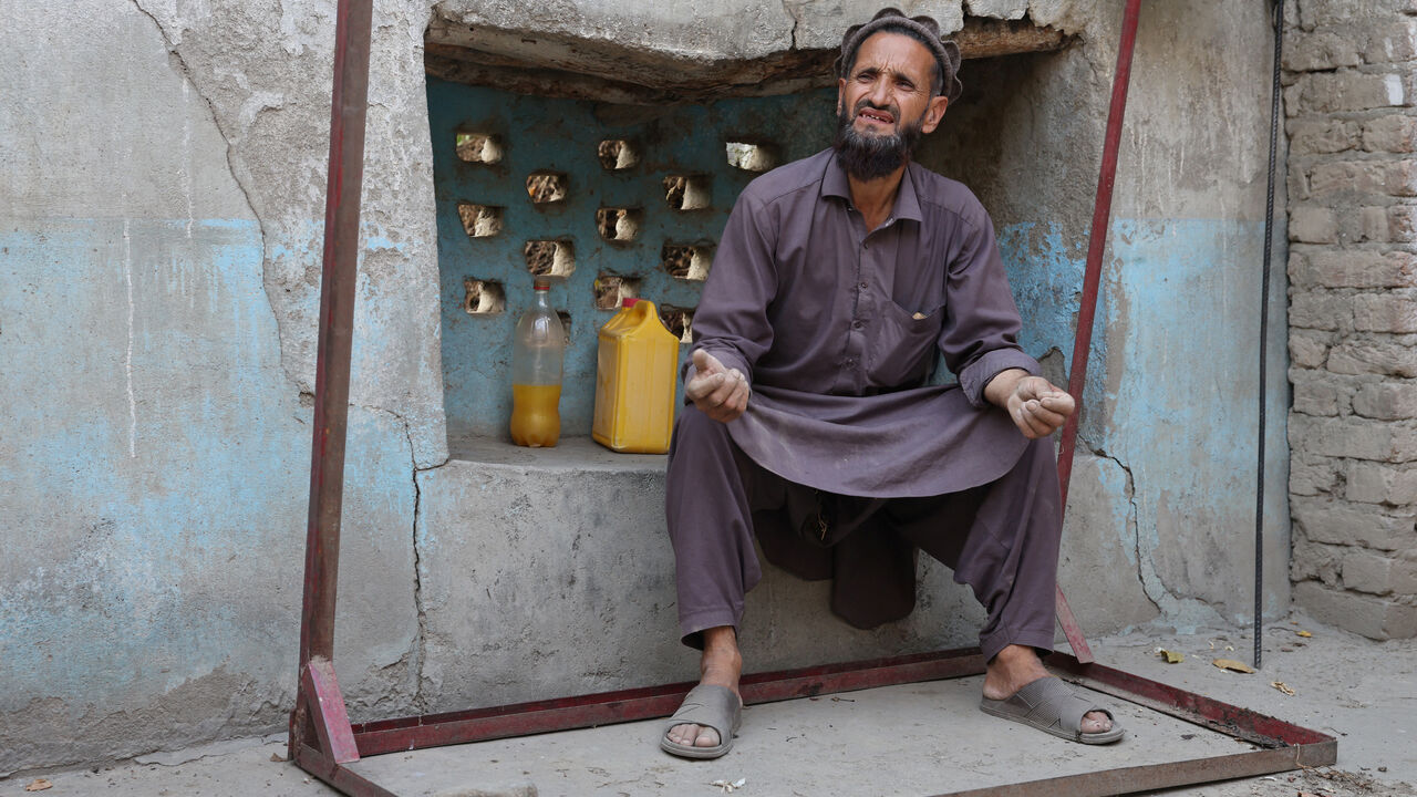 Abdul Ghafar, 52, sits at his partially damaged house as he speaks during an interview with Reuters, following a deadly earthquake in Bambakot village in Dera Noor district in Nangarhar province, Afghanistan September 6, 2025. REUTERS/Sayed Hassib