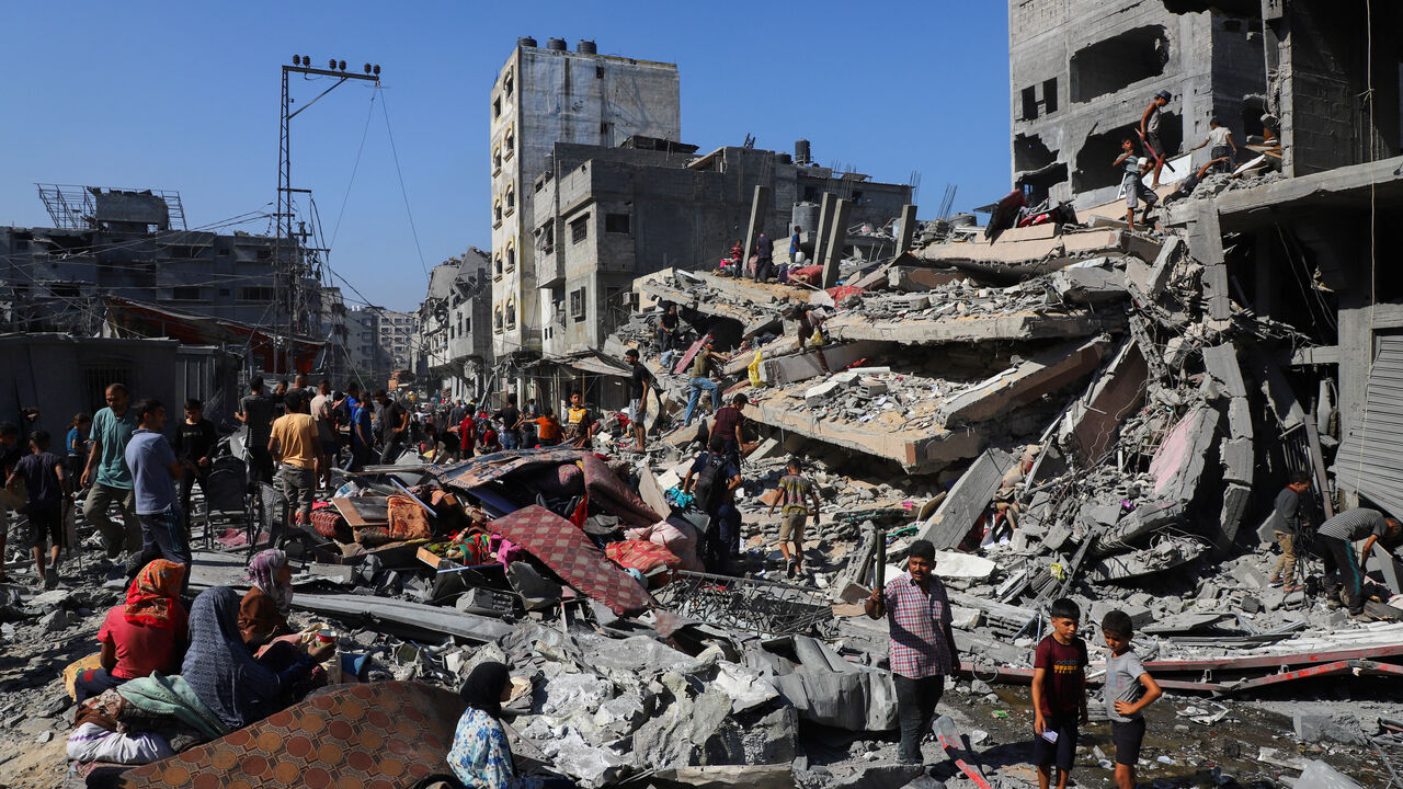 Palestinians inspect the site of Israeli air strikes on houses, at al-Shati (Beach) refugee camp, in Gaza City, September 12, 2025. REUTERS/Ebrahim Hajjaj