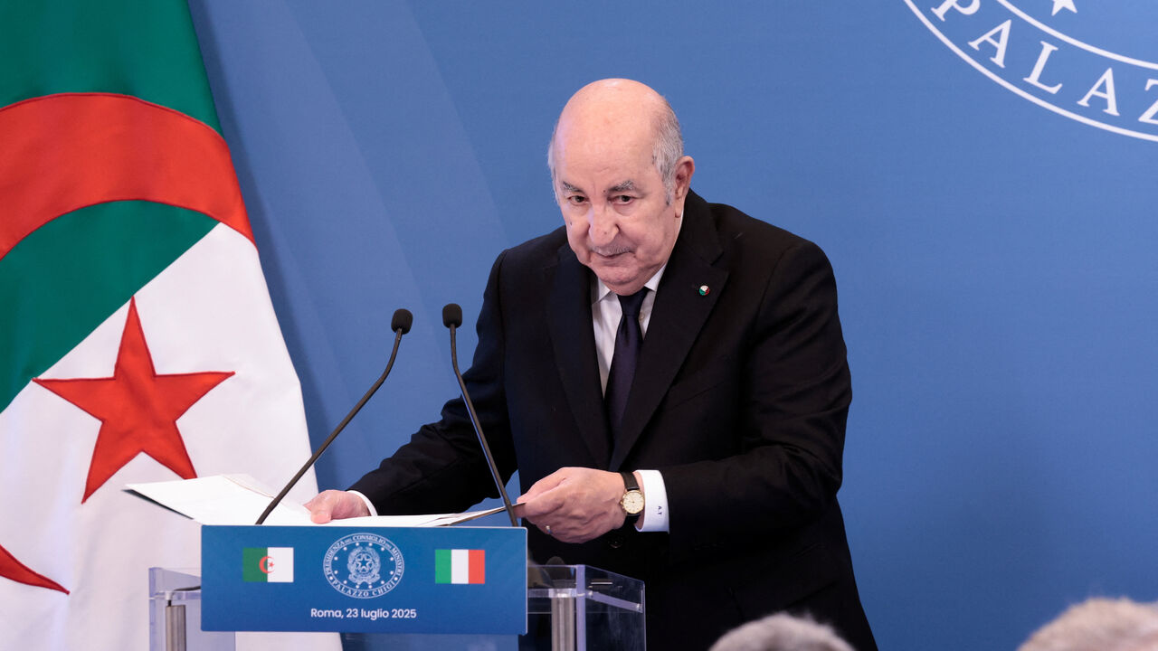 FILE PHOTO: Algerian President Abdelmadjid Tebboune looks on as he leaves following agreement signing, during the Italy-Algeria summit at Villa Doria Pamphilj in Rome, Italy, July 23, 2025. REUTERS/Remo Casilli/File Photo