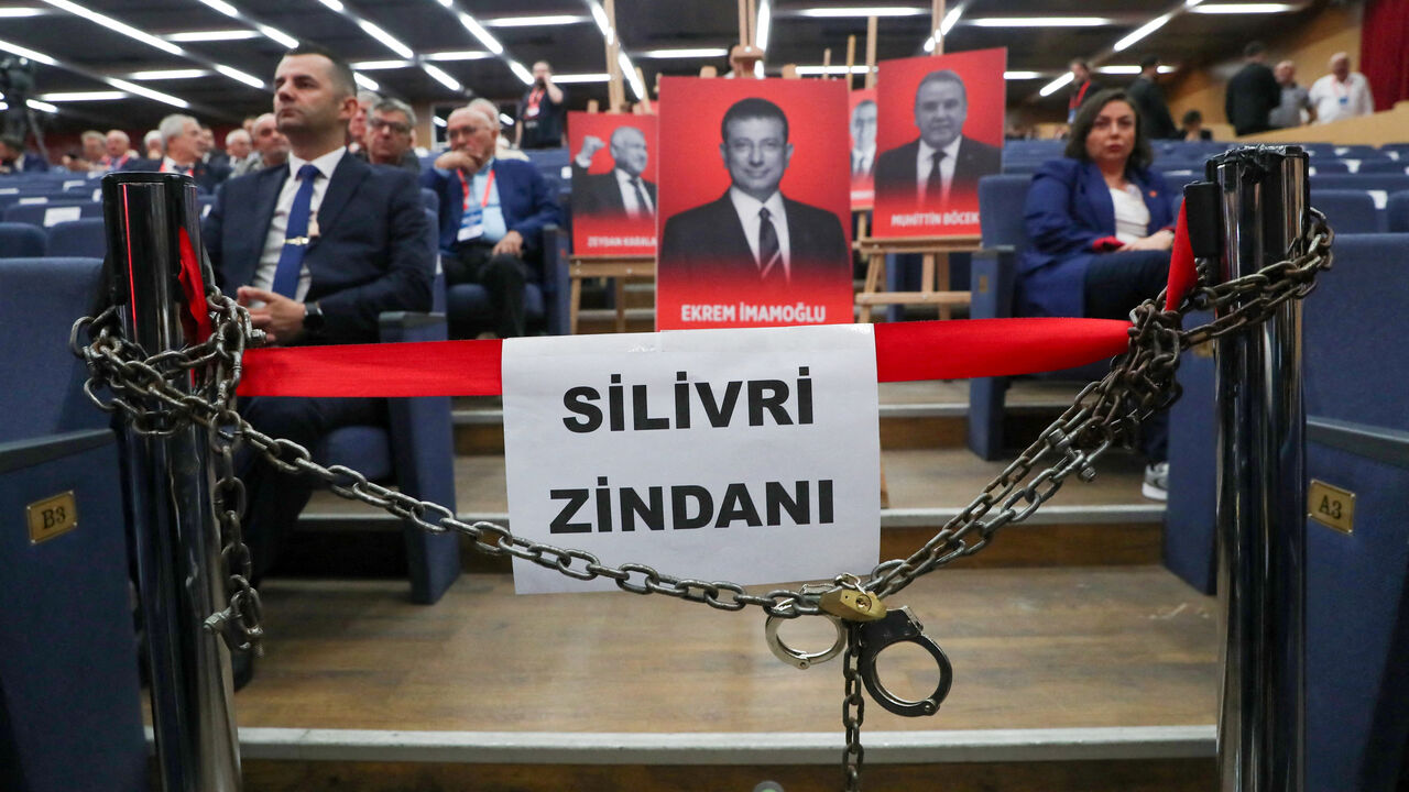 Portraits of jailed mayors, including one of Istanbul Mayor Ekrem Imamoglu displayed with symbolic props such as chains, handcuffs, and a banner referencing Silivri Prison, are presented as a political protest ahead of the opening session of Turkey's main opposition Republican People's Party (CHP) 22nd extraordinary congress in Ankara, Turkey, September 21, 2025. REUTERS/Cagla Gurdogan