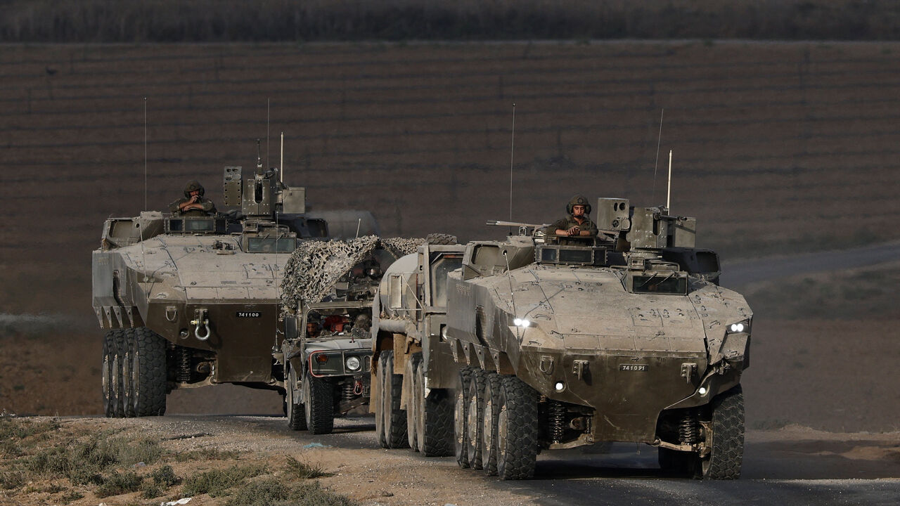 An Israeli military convoy manoeuvres on Israeli side of the Israel-Gaza border, in Israel, September 21, 2025. REUTERS/Amir Cohen/File Photo