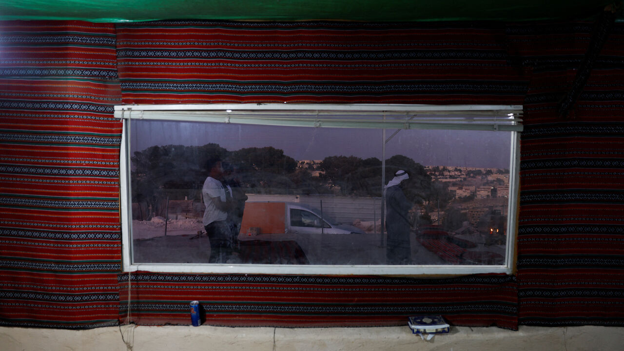 Palestinian Bedouin men pray, as the communities of Jabal Al-Baba face displacement due to plans to build a new Israeli settlement near the E1 road, in Jabal Al-Baba in the Israeli-occupied West Bank, September 17, 2025. REUTERS/Ammar Awad