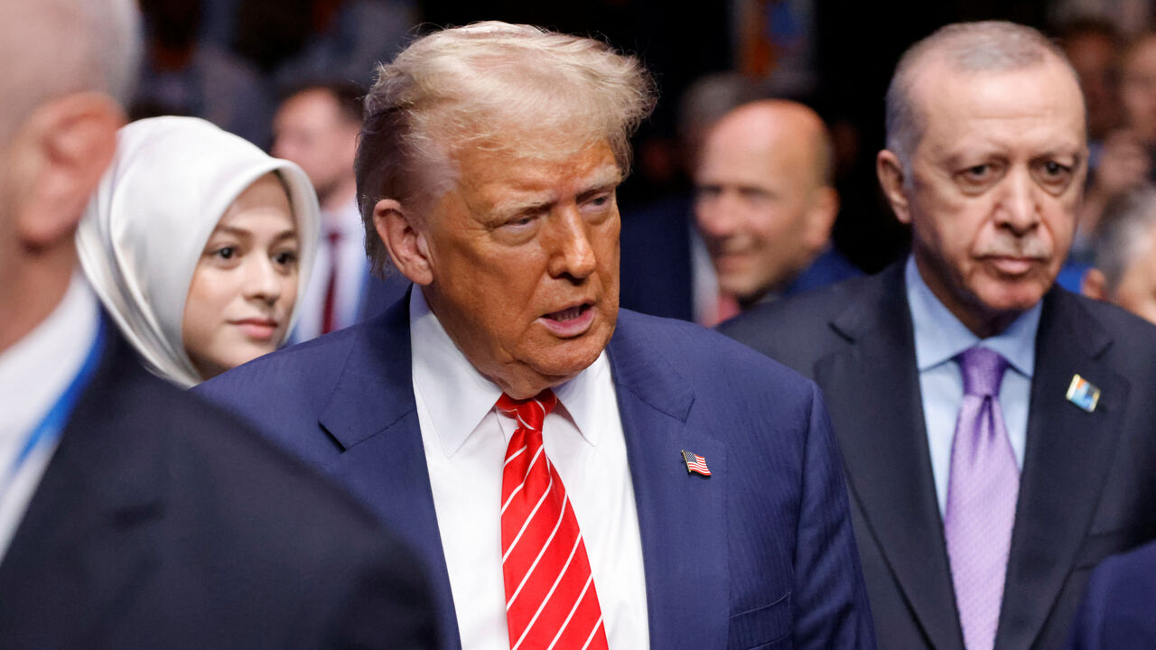 US President Donald Trump and Turkey's President Recep Tayyip Erdogan arrive to attend the North Atlantic Council plenary meeting at the North Atlantic Treaty Organisation (NATO) summit in The Hague on June 25, 2025.   LUDOVIC MARIN/Pool via REUTERS/File Photo