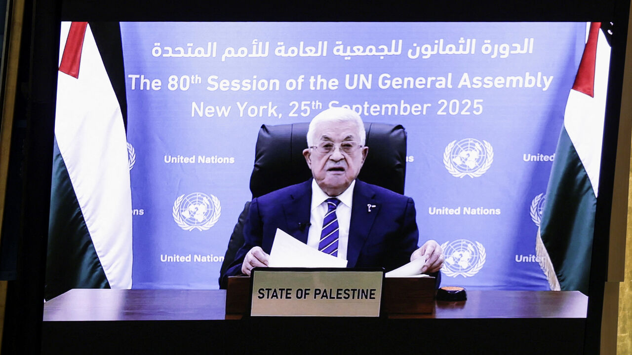 Palestinian President Mahmoud Abbas appears on a screen as he addresses the 80th United Nations General Assembly (UNGA), at the U.N. headquarters in New York, U.S., September 25, 2025. REUTERS/Jeenah Moon