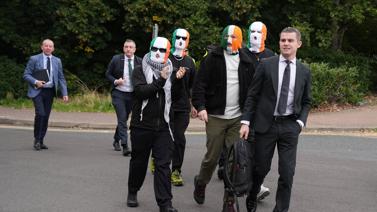 Member of the rap group Kneecap, Liam O'Hanna, also known as Liam Og O hAnnaidh and performing under the name of Mo Chara, who has been charged with a terrorism offence in relation to the alleged display of a Hezbollah flag onstage in 2024, walks outside the Woolwich Crown Court on the day of a hearing, in London, Britain, September 26, 2025. REUTERS/Maja Smiejkowska