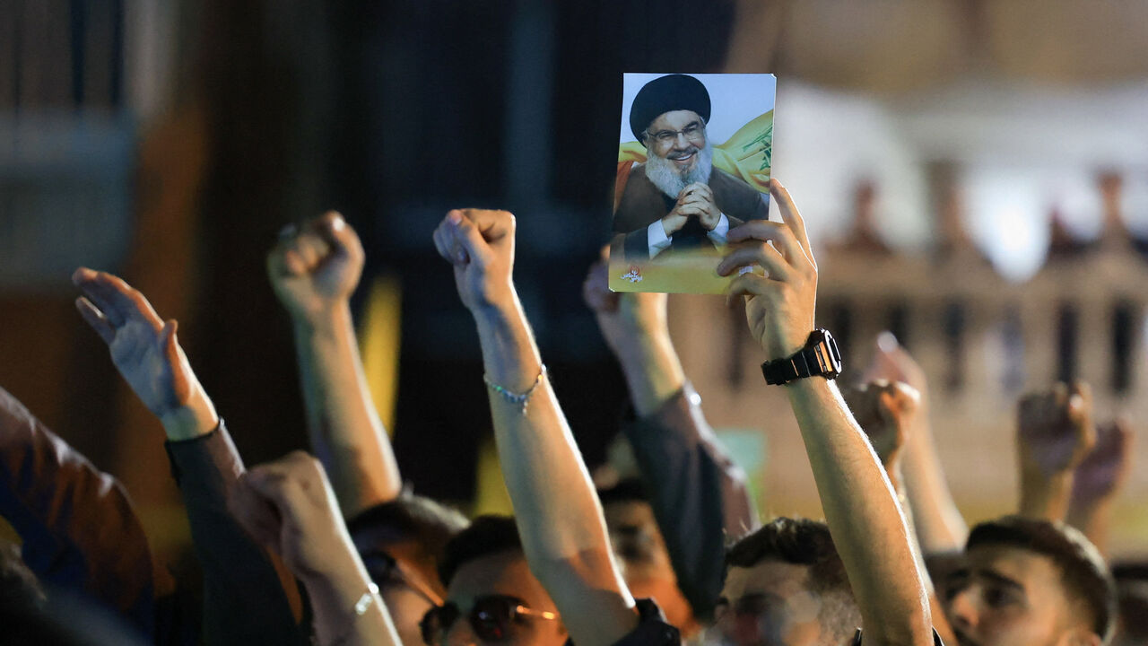 Hezbollah supporters gesture as they gather at the site where the group's late leader Hassan Nasrallah was killed, before the first anniversary of his assassination in an airstrike, in Beirut's southern suburbs, Lebanon, September 26, 2025. REUTERS/Mohamed Azakir