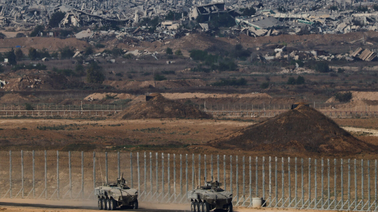 Israeli armoured personnel carriers (APC) manoeuvre on Israeli side of the Israel-Gaza border, in Israel, September 30, 2025. REUTERS/Amir Cohen