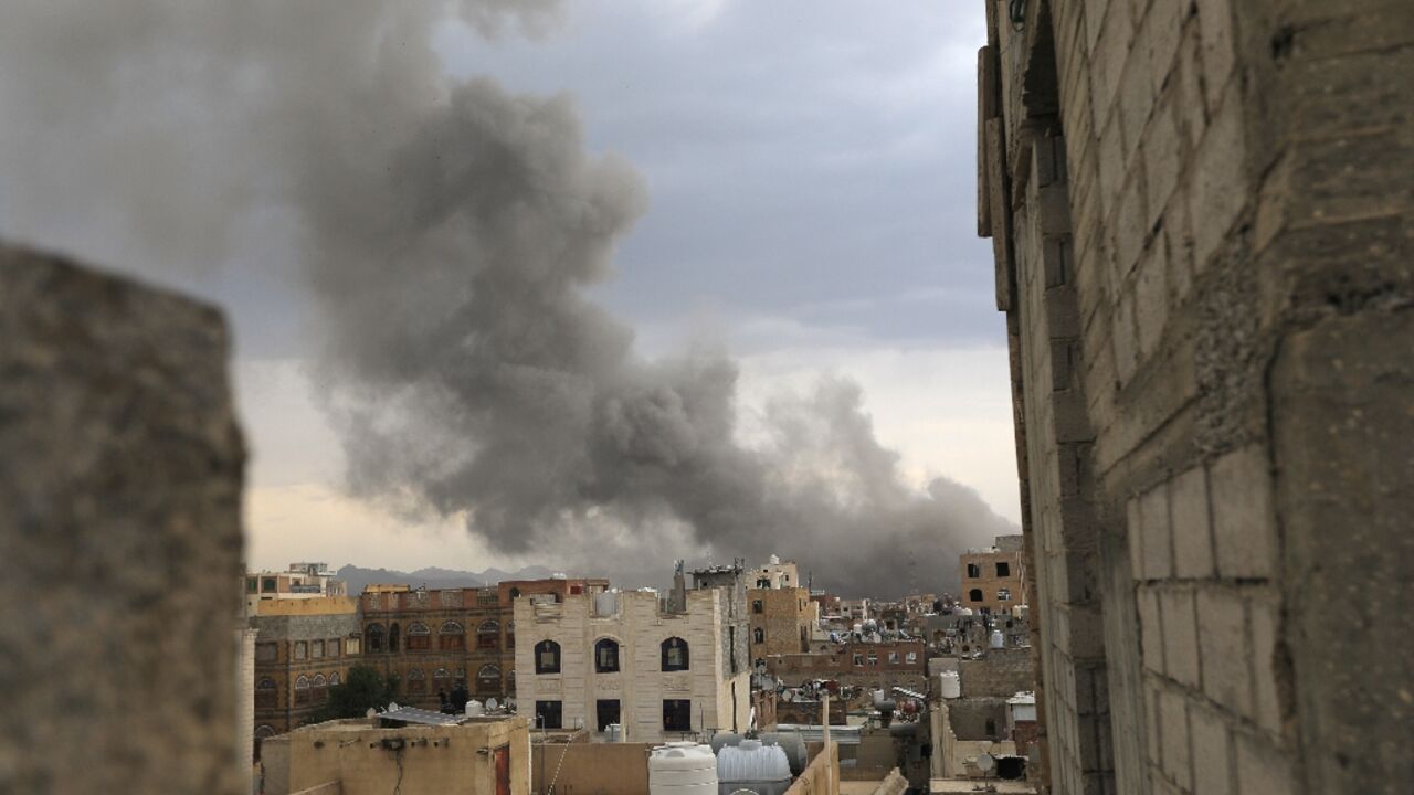 Smoke billows over Sanaa after Israel strikes Huthi targets in the rebel-held Yemeni capital.