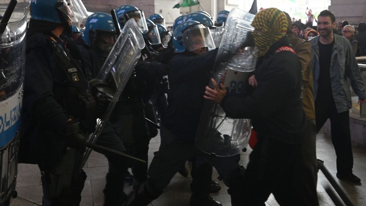 Protesters clashed with anti-riot police at Milano Centrale train station