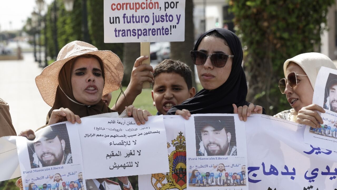 Moroccan survivors of the 2008 earthquake protest their exclusion from the governmental compensation schemes in front of the parliament building in Rabat
