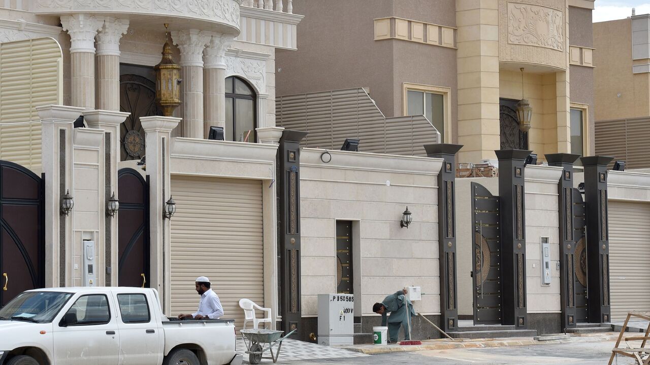 Foreign laborers work on the construction of new luxury houses in the Saudi capital, Riyadh, on April 13, 2019. 