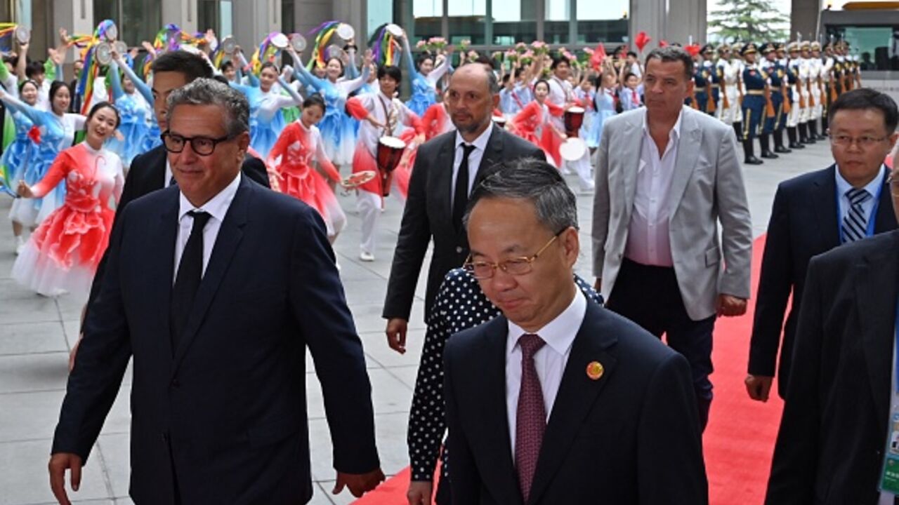 Morocco Prime Minister Aziz Akhannouch (L) walks with officials upon arriving at the Beijing Capital International airport in Beijing on September 4, 2024. (ADEK BERRYADEK BERRY/AFP via Getty Images)
