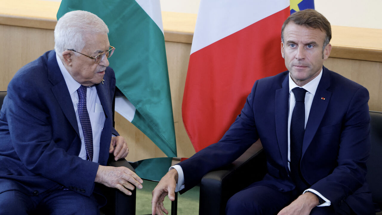 French President Emmanuel Macron (R) meets with Palestinian President Mahmud Abbas on the sidelines of the 79th Session of the United Nations General Assembly in New York on September 25, 2024. (Photo by Ludovic MARIN / AFP) (Photo by LUDOVIC MARIN/AFP via Getty Images)