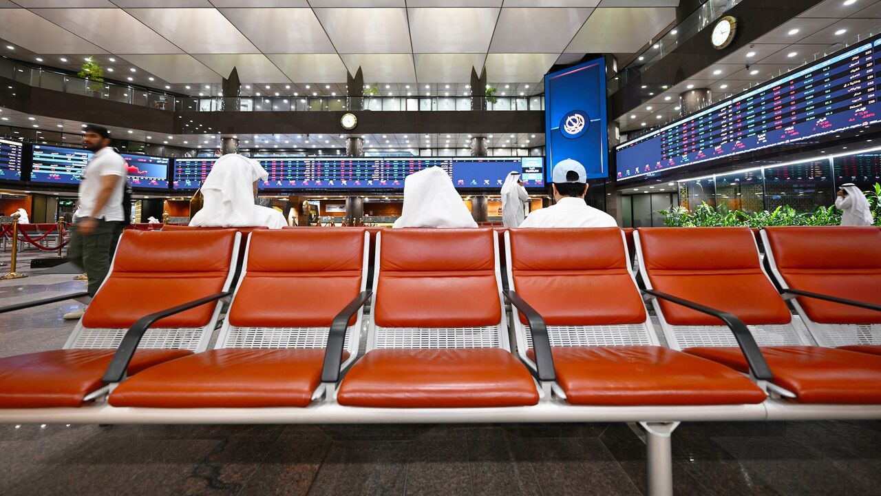 Kuwaiti traders follow the stock market activity at Boursa Kuwait, in Kuwait City on April 7, 2025. 