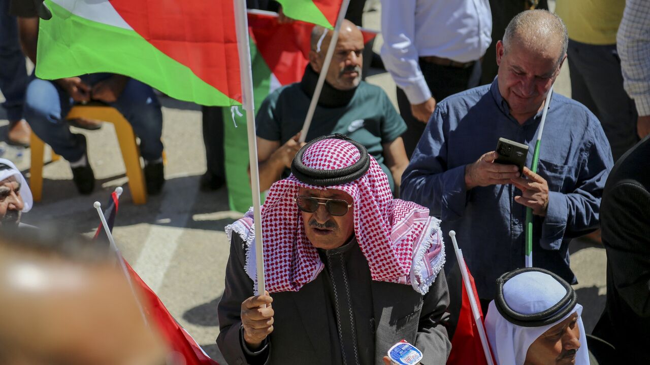 Representatives of prominent families in Hebron attend a gathering.