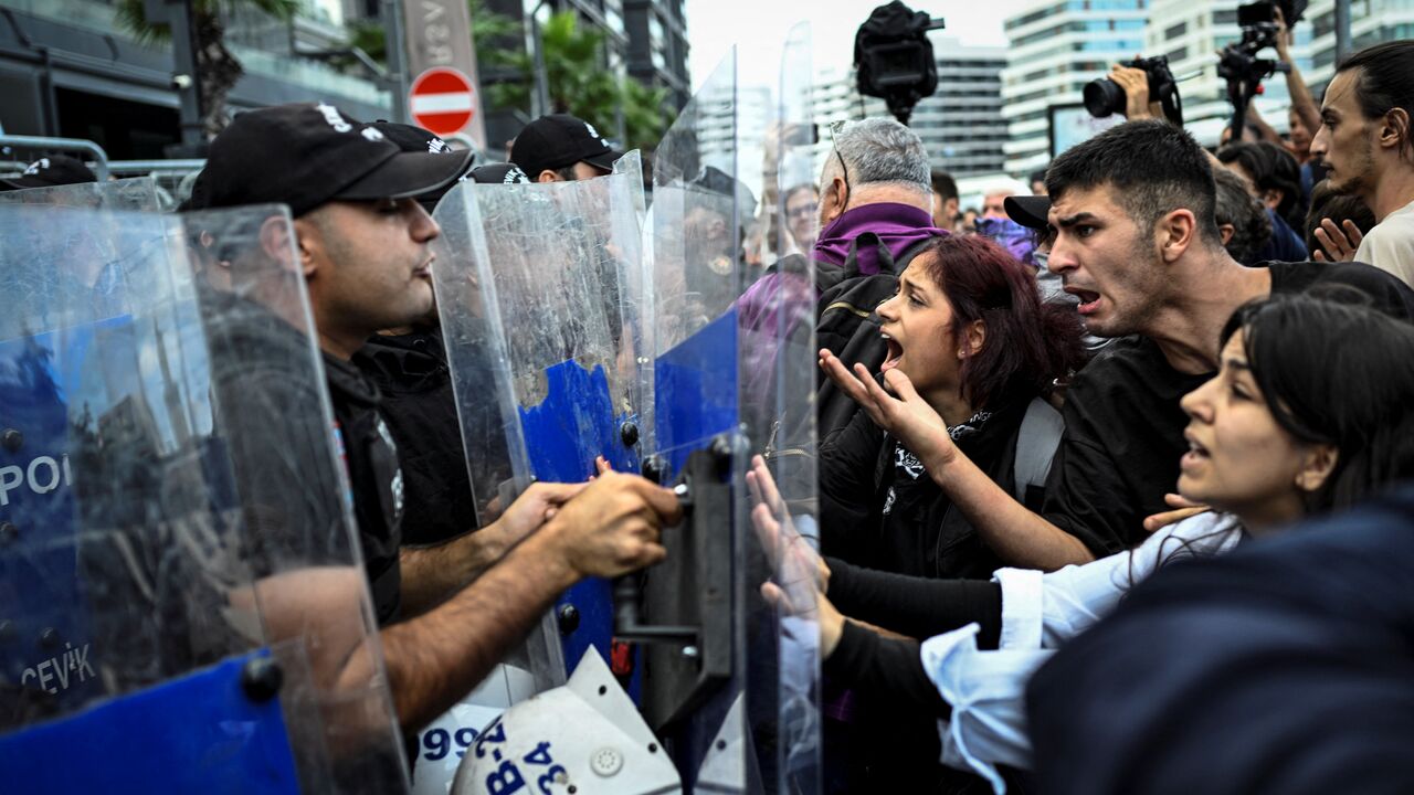 Protesters clash with Turkish anti-riot police officers near the Istanbul Province headquarters of Turkey's main opposition party Republican People's Party (CHP), on Sept. 8, 2025, in Istanbul. 