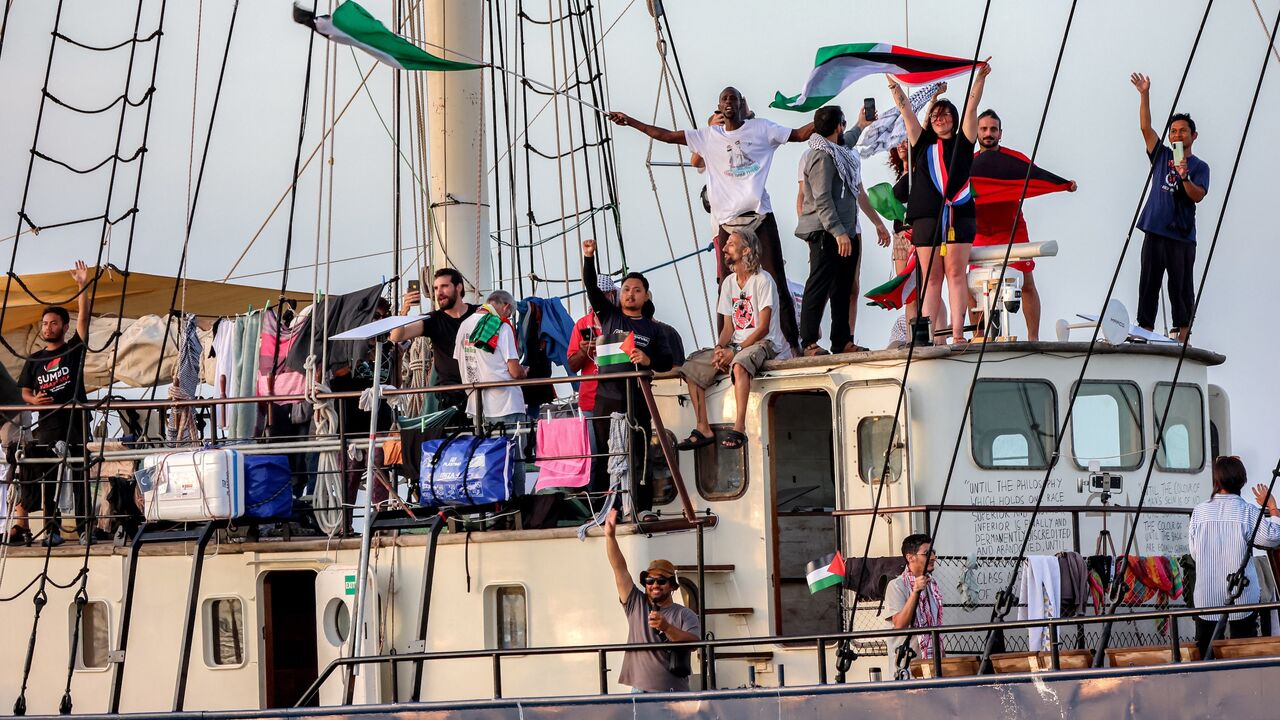 Activists and human rights defenders ride aboard a vessel departing from Tunisia's northern port of Bizerte on Sept. 14, 2025.