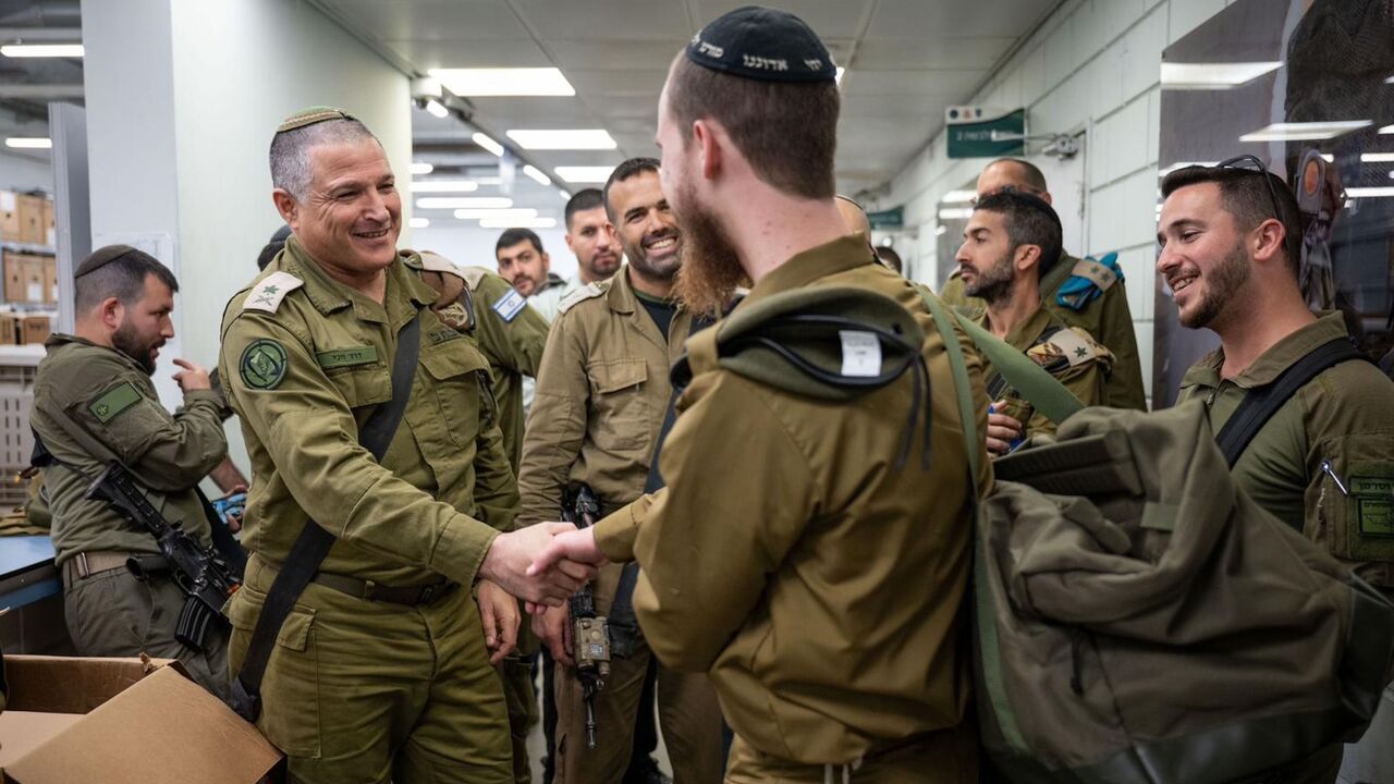 Maj. Gen. David Zini, head of the Israeli military Training Command (left), greets an ultra-Orthodox soldier drafted into the  Hasmonean Brigade, Jan. 5, 2025.