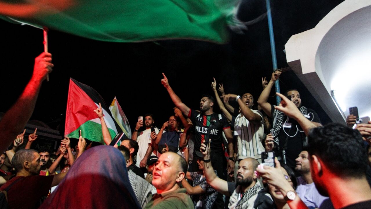 Tunisian protesters at the port of Sidi Bou Said near Tunis on September 9, 2025, after the organisers of a Gaza-bound flotilla said one of their boats was hit by a suspected drone