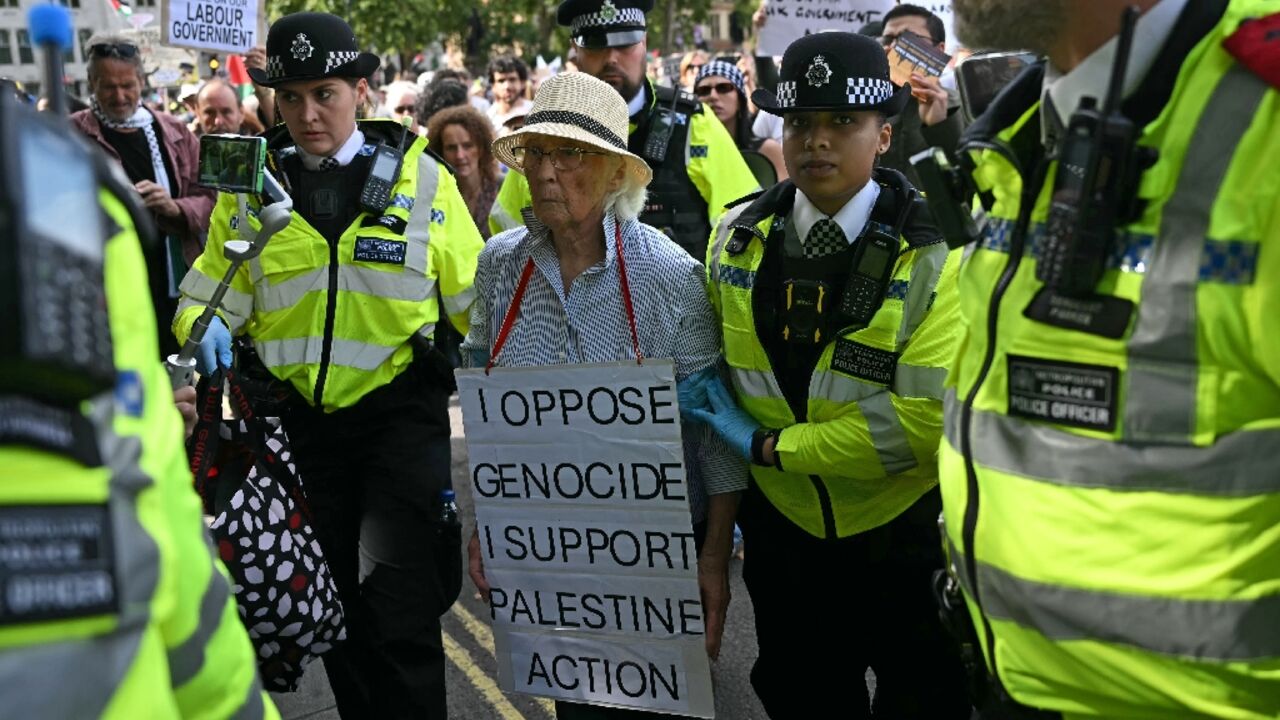 An elderly protester was taken away by police at the 'Lift The Ban' demo
