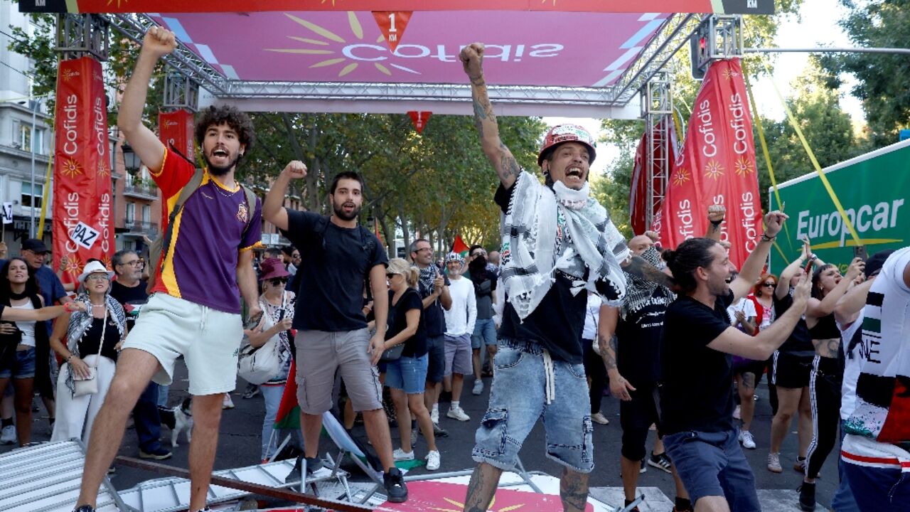 Pro-Palestinians protestors invade the street during the 21st and last stage of the Vuelta a Espana 2025