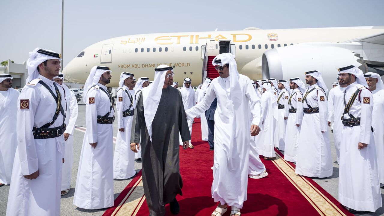 Sheikh Tamim bin Hamad Al Thani (L) welcomes Sheikh Mohammed Bin Zayed Al Nahyan (R) to Hamad International Airport in Doha, on Sept. 10, 2025.