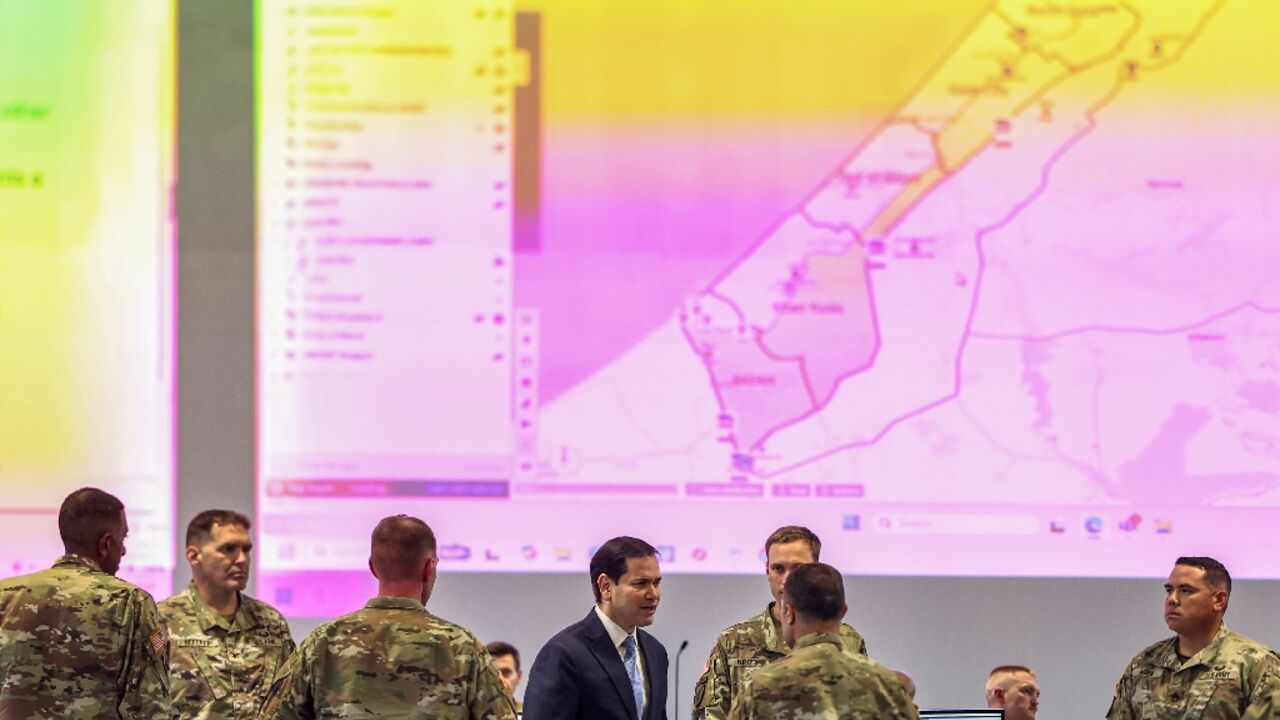 US Secretary of State Marco Rubio  speaks with US military personnel as he visits the Civil-Military Coordination Center in southern Israel 