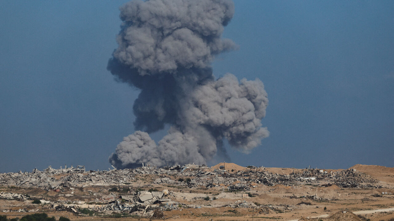 Smoke rises from Gaza after an explosion, as seen from the Israeli side of the border. REUTERS/Amir Cohen
