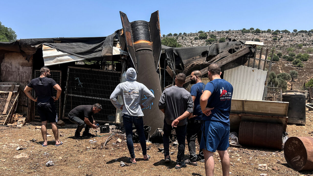 People look at an apparent remains of a ballistic missile following today's missile attack by Iran on Israel, in northern Israel, June 24, 2025. REUTERS/Avi Ohayon