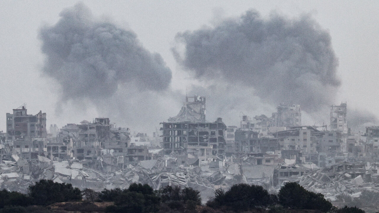 Smoke rises from Gaza after explosions, as seen from the Israeli side of the border with Gaza, October 5, 2025. REUTERS/Amir Cohen