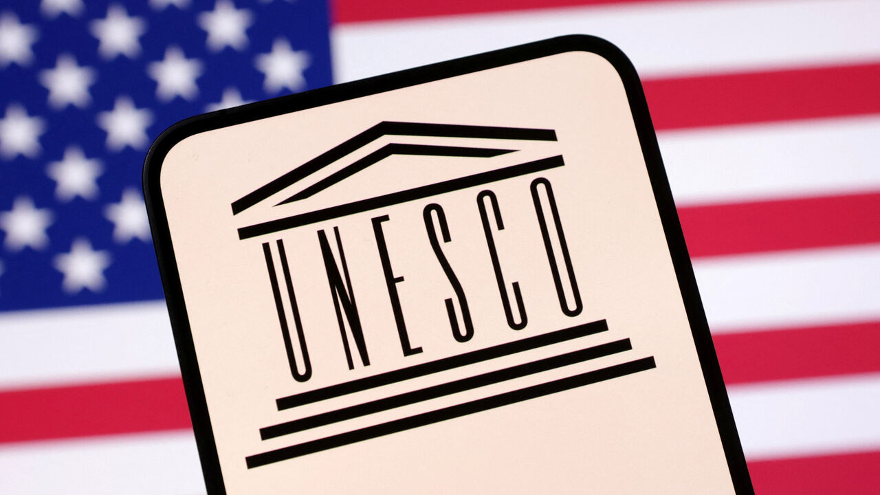 UNESCO logo and U.S. flag are seen in this illustration taken April 23, 2025. REUTERS/Dado Ruvic/Illustration