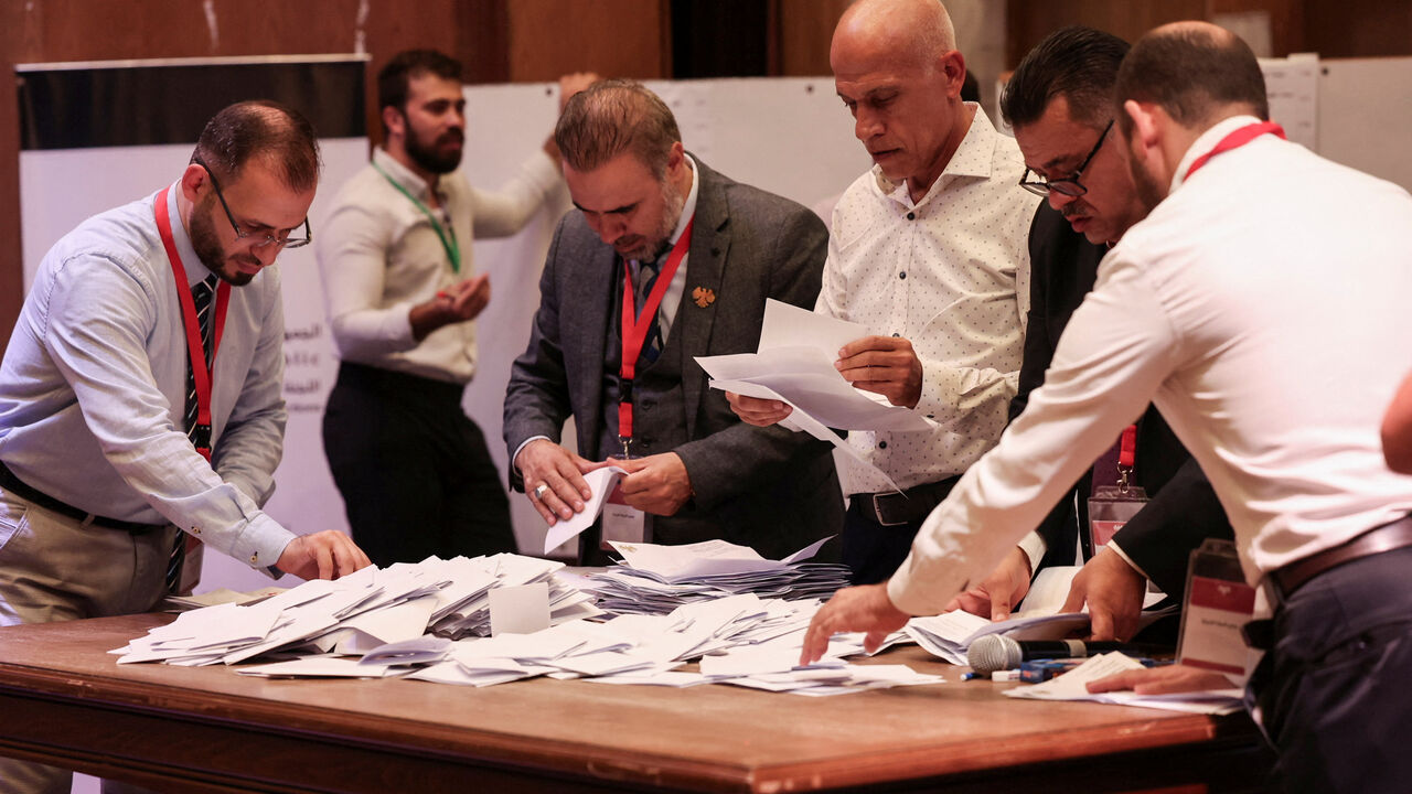 Members of electoral colleges count votes, on the day they vote for candidates of the new Syrian Parliament since Bashar al-Assad's government was toppled, in Aleppo, Syria, October 5, 2025. REUTERS/Mahmoud Hassano