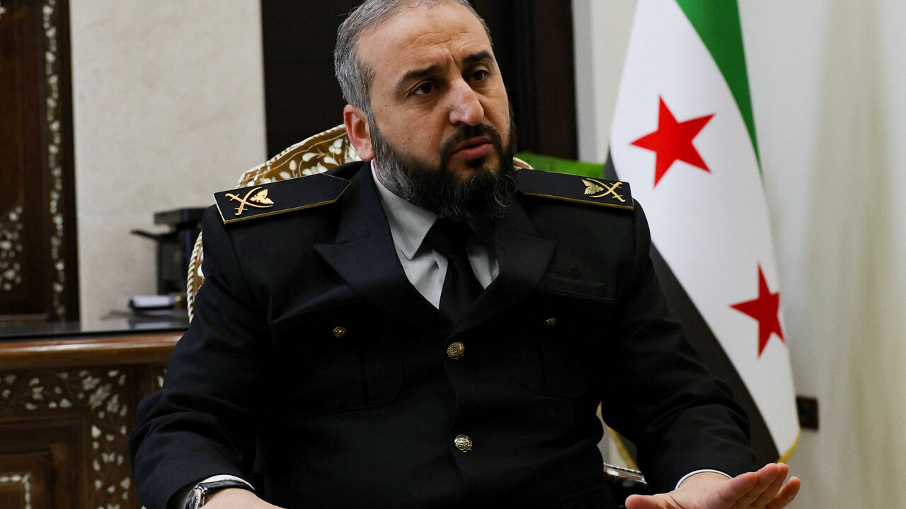 Syria's new defense minister Murhaf Abu Qasra attends an interview with Reuters in Damascus, Syria January 19, 2025. REUTERS/Yamam Al Shaar