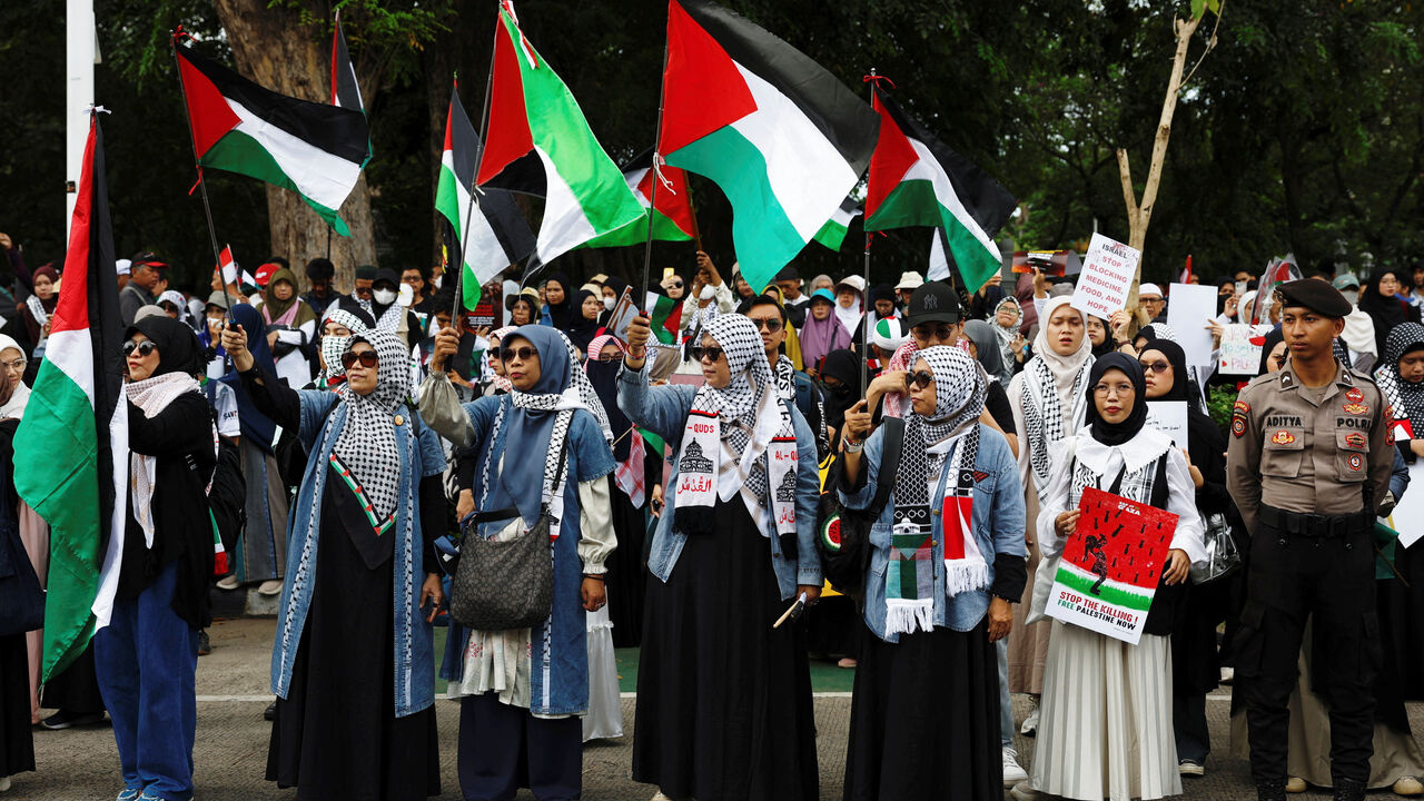 People take part in a protest in solidarity with Palestinians in Gaza on the second anniversary of the war that began after Hamas' attack on Israel on October 7, 2023, outside the U.S. Embassy in Jakarta, Indonesia, October 7, 2025. REUTERS/Ajeng Dinar Ulfiana