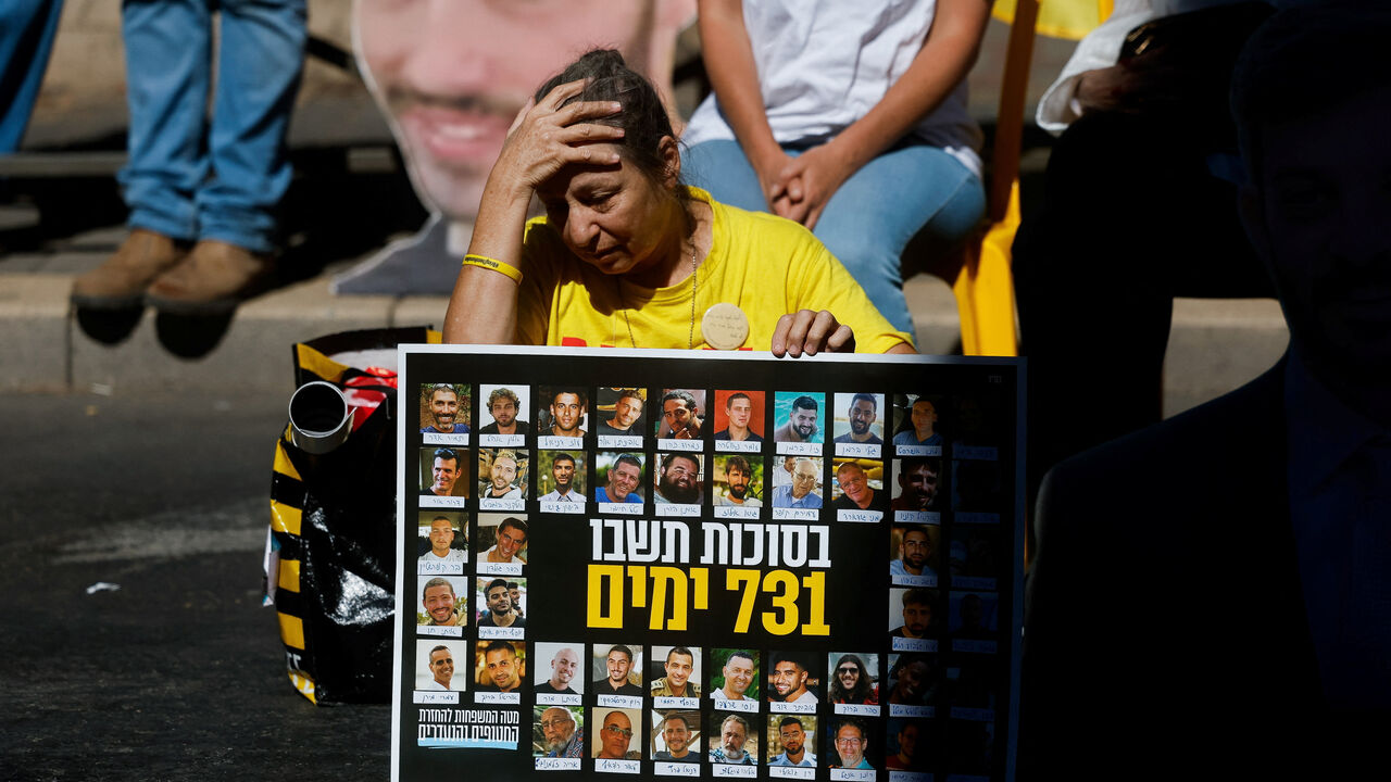 A woman reacts as families of Israeli hostages and supporters protest outside Israeli Prime Minister Benjamin Netanyahu's residence, marking the two-year anniversary of the deadly October 7, 2023 attack on Israel by Hamas from Gaza, in Jerusalem, October 7, 2025. REUTERS/Ammar Awad     TPX IMAGES OF THE DAY