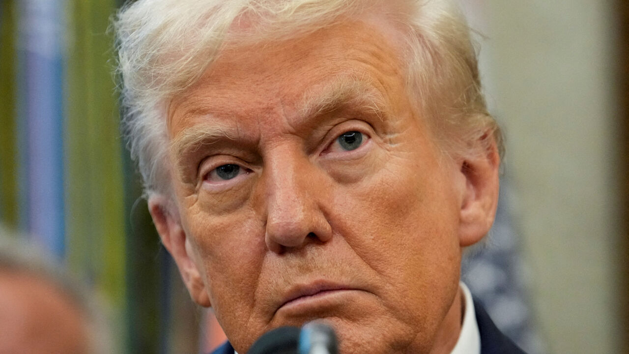 FILE PHOTO: U.S. President Donald Trump looks on as he announces a deal with Pfizer to sell drugs at lower prices, in the Oval office of the White House in Washington, D.C., U.S., September 30, 2025. REUTERS/Ken Cedeno/File Photo