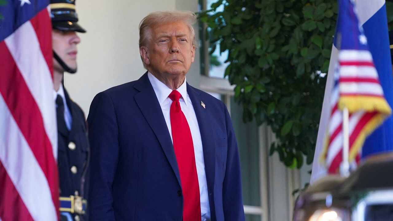 U.S. President Donald Trump looks on before welcoming Finland's President Alexander Stubb at the White House in Washington, D.C., U.S., on October 9, 2025. REUTERS/Nathan Howard