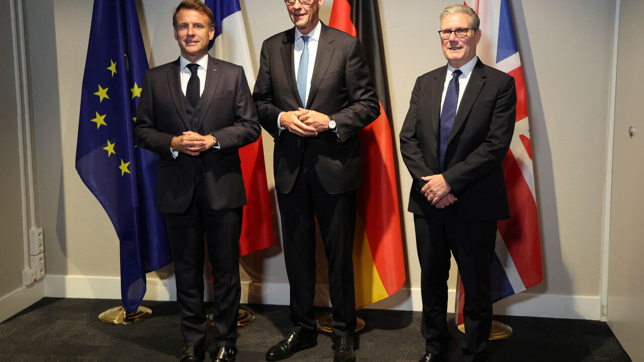 France's President Emmanuel Macron, Germany's Chancellor Friedrich Merz and Britain's Prime Minister Keir Starmer pose as they meet on the sidelines of the two-day NATO's Heads of State and Government summit, in The Hague, Netherlands June 24, 2025. Ludovic Marin/Pool via REUTERS