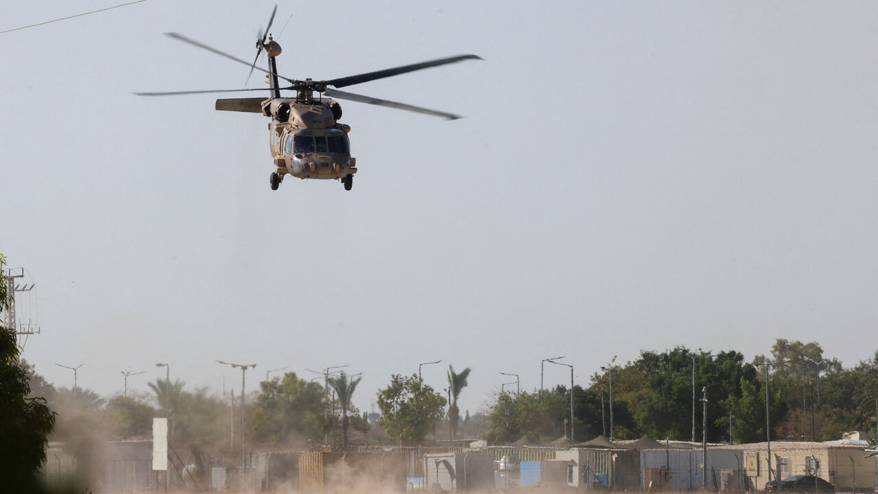 An Israeli black hawk helicopter departs from Reim military base, where the Israeli hostages are expected to arrive after their release, amid a ceasefire between Israel and Hamas in Gaza, in southern Israel, October 11, 2025. REUTERS/Hannah McKay