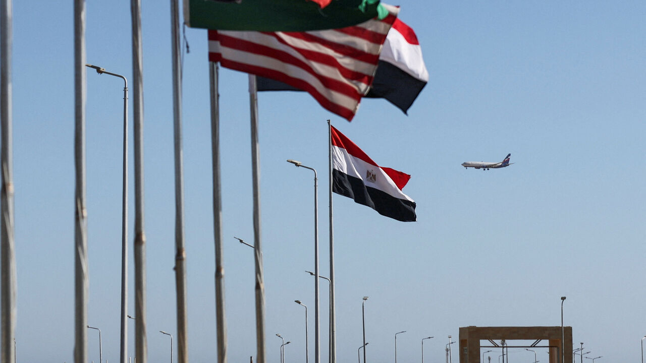 An Egyptian flag flutters among others as a plane flies in the background, during preparations for an international summit on Gaza, amid a ceasefire between Israel and Hamas, at the Red Sea resort of Sharm el-Sheikh, Egypt, October 11, 2025. REUTERS/Amr Abdallah Dalsh