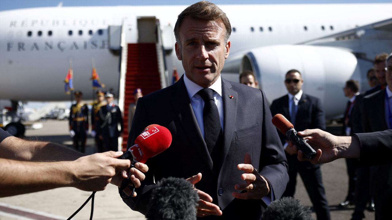 French President Emmanuel Macron speaks to the members of the media, after arriving by plane to attend the Gaza Peace Summit, in Sharm el-Sheikh, Egypt, October 13, 2025. Yoan Valat/Pool via REUTERS